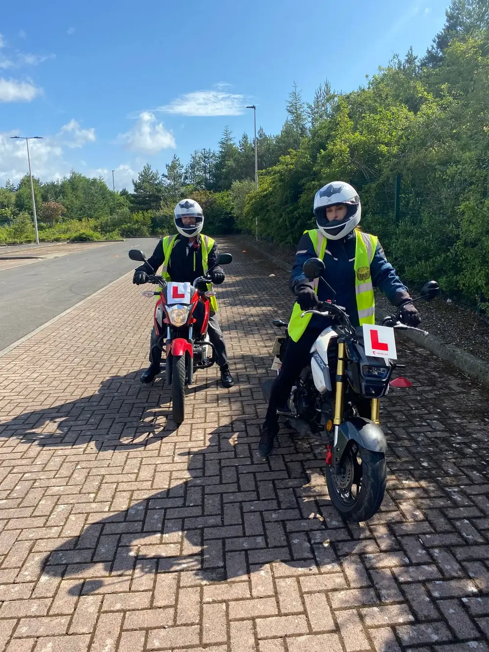 Two learners practising on the open training area at Straiton Park and Ride