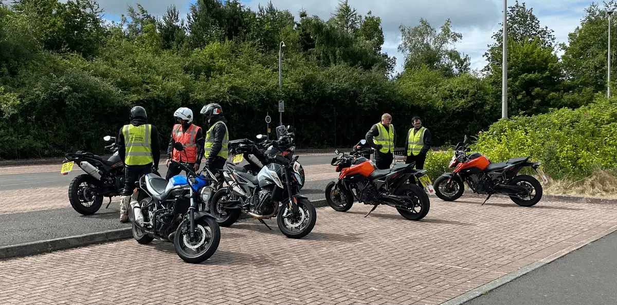 A group of riders and instructors on the open training area